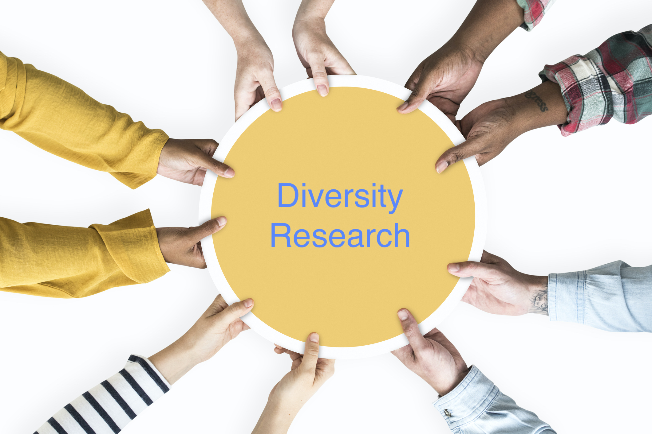 Diverse hands supporting a blank yellow round board Diverse hands supporting a blank yellow round board